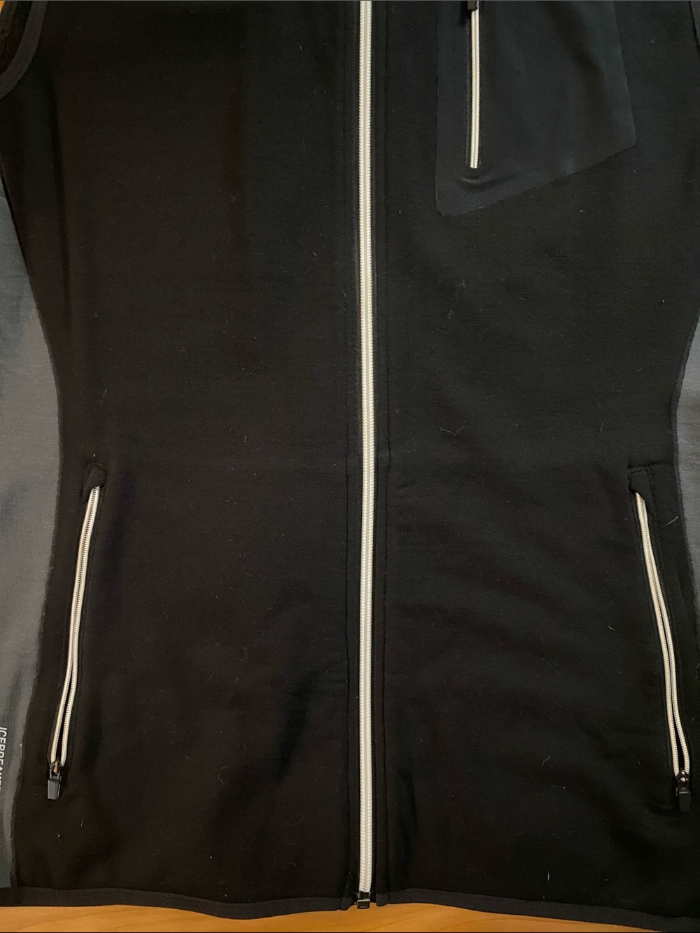 Icebreaker Black Merino Wool Full-Zip Vest with Chest Zip Pocket and side panels - Picture 4 of 9